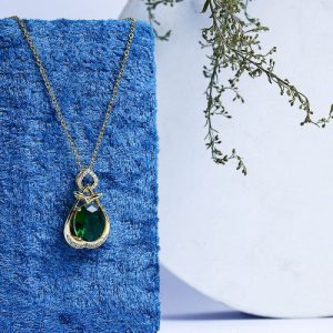 Gold Necklace Embellished With Sparkling Zircon Stones And A Large Colorful Gem