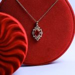 Gorgeous Gold Necklace With Sparkling Zircon Stones And A Colorful Gem Standing Out With Elegance