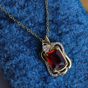 Timeless Elegance Shines Through In This Gold Necklace, Studded With Radiant Zircon And A Colorful Gem