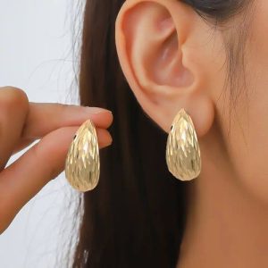 Add A Touch Of Nighttime Magic With These Shell -inspired Gold Earrings