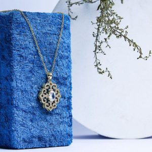 A Gold Necklace That Adds A Touch Of Luxury With Sparkling Zircon And A Colorful Gem