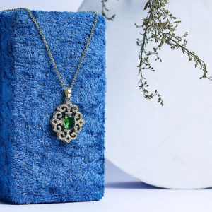 A Gold Necklace That Adds A Touch Of Luxury With Sparkling Zircon And A Colorful Gem