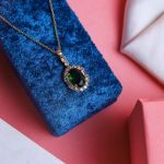 Modern Gold Necklace With Gleaming Zircon And A Colorful Gem That Adds A Touch Of Brilliance
