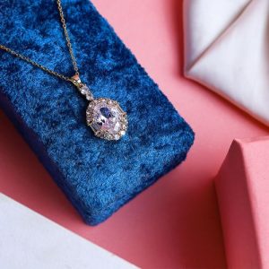 Modern Gold Necklace With Gleaming Zircon And A Colorful Gem That Adds A Touch Of Brilliance