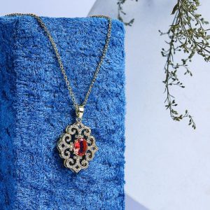 A Gold Necklace That Adds A Touch Of Luxury With Sparkling Zircon And A Colorful Gem