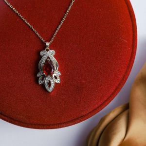 Feminine Gold Necklace Adorned With Bright Zircon And A Vibrant Central Gem