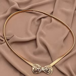 Gold metal belt with decorative bow tie