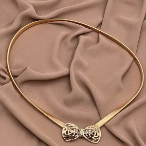 Gold metal belt with decorative bow tie